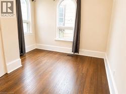 Warm wood-finish flooring complements the neutral wall tones - 