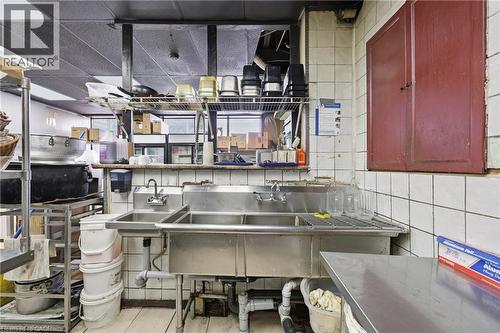Commercial-grade stainless steel triple-basin sink with dual faucets - 239 York Boulevard, Hamilton, ON 
