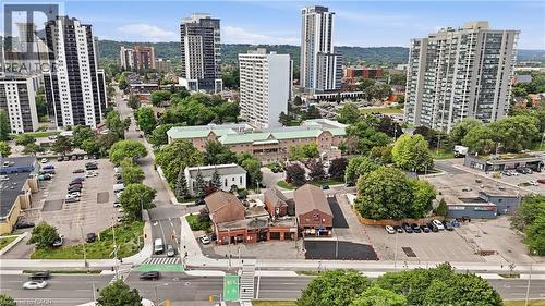 Aerial perspective of an urban setting with multiple high-rise buildings and commercial properties - 239 York Boulevard, Hamilton, ON 