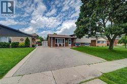 Brown brick exterior with white trim and a covered porch - 