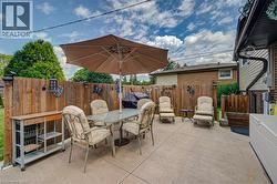 Expansive concrete patio area with full privacy fencing - 