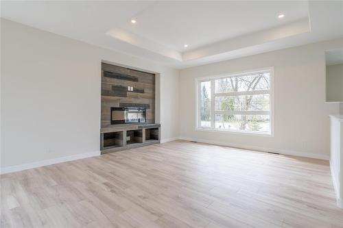 3 Elizabeth Waytiuk Cove, East Selkirk, MB - Indoor With Fireplace