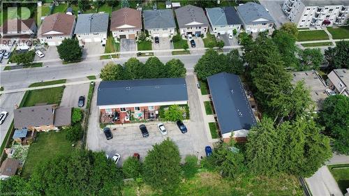 Aerial perspective showcasing two multi-unit buildings with dark roofs - 181 Thaler Avenue, Kitchener, ON 