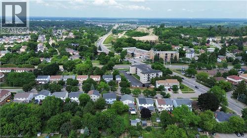 Residential area with established trees and direct access to an arterial road, providing convenient access to surrounding areas - 181 Thaler Avenue, Kitchener, ON 
