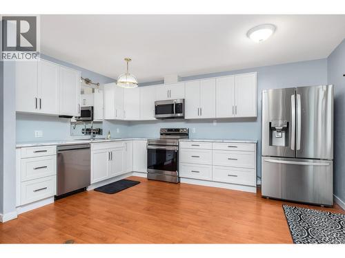 New appliances under a 5 year warranty - 5008 Heritage Drive, Vernon, BC - Indoor Photo Showing Kitchen