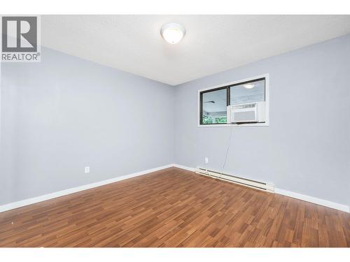 Back bedroom main floor - 5008 Heritage Drive, Vernon, BC - Indoor Photo Showing Other Room