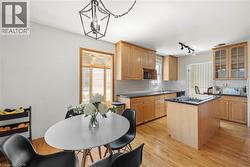 Hardwood flooring throughout the kitchen and dining area - 