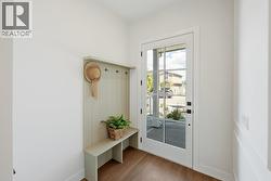 Front entry/foyer with built-in bench and coat hooks - 
