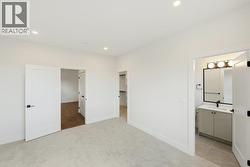 Primary bedroom with 3-piece ensuite and walk-in closet - 