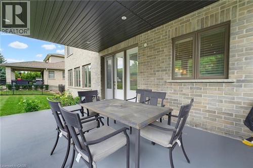 Covered outdoor patio with a concrete surface and recessed lighting - 38 River Valley Drive, Kitchener, ON 