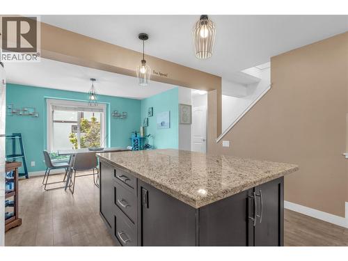 Kitchen looking into the dining area. Lots of natural light. - 128-1651 Lynrick Road, Kelowna, BC 