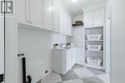 Main Level Laundry located off walk-in closet - 