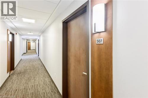 Long hallway with patterned carpet flooring, white walls, and recessed ceiling lighting - 340 Plains Road E Unit# 507, Burlington, ON - Indoor Photo Showing Other Room