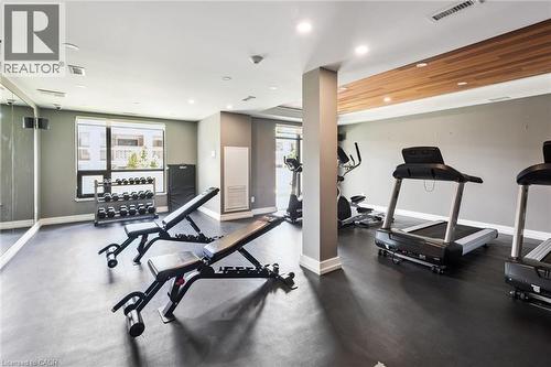 Dedicated fitness space featuring rubber flooring, recessed lighting, and a wood-finish ceiling accent - 340 Plains Road E Unit# 507, Burlington, ON - Indoor Photo Showing Gym Room