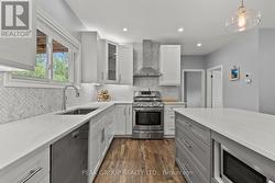 Beautiful white kitchen with shaker cabinets - 
