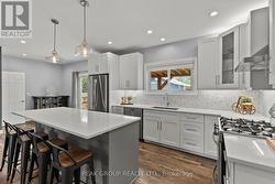 Quartz counter/stainless appliances and backsplash - 
