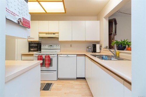 #302-2311 Mills Rd, Sidney, BC - Indoor Photo Showing Kitchen With Double Sink