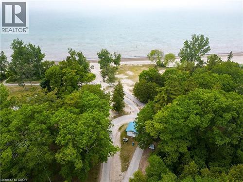 Aerial perspective showcasing a shoreline property with extensive tree coverage - 42 5Th Lane, Wasaga Beach, ON - Outdoor With View