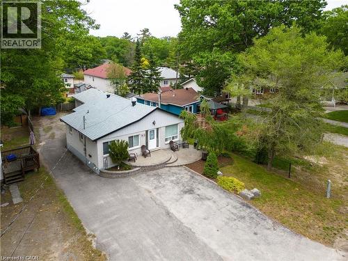 Single-story residence featuring a light gray exterior with dark trim and a gabled roof - 42 5Th Lane, Wasaga Beach, ON - Outdoor