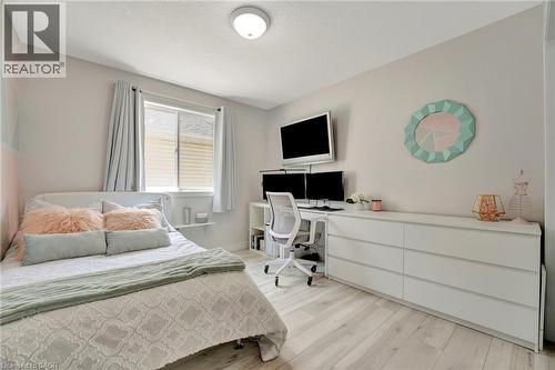 Light wood-finish flooring complements the neutral wall color - 35 Dubrick Crescent, Kitchener, ON 