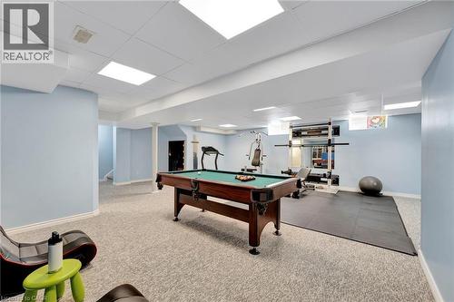 Finished basement with light blue walls and recessed lighting - 35 Dubrick Crescent, Kitchener, ON 