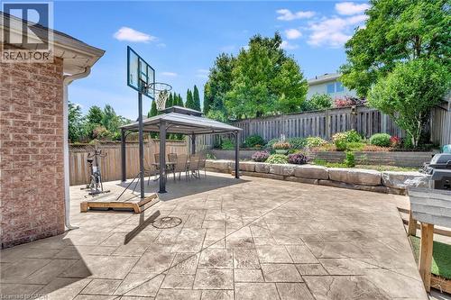 Spacious stamped concrete patio featuring an outdoor gazebo - 35 Dubrick Crescent, Kitchener, ON 