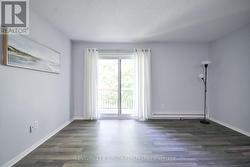 Living room with walk out to balcony. - 