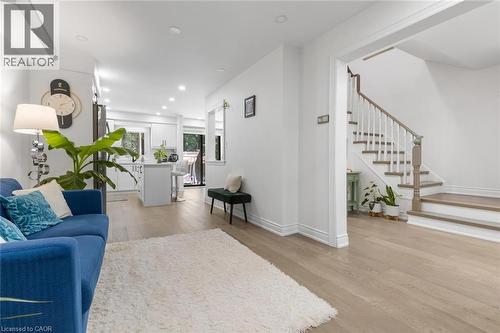 Living area featuring recessed lighting, light wood-style floors, and stairway - 1118 Avondale Drive, Oakville, ON 