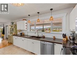 White and bright kitchen, enjoy views while you are preparing a meal. - 