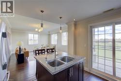Kitchen island with double basin sink and granite countertop - 
