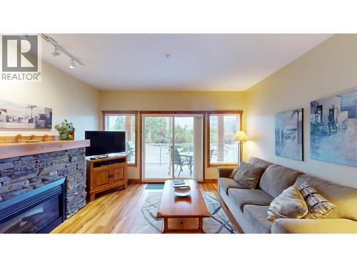 701 14A Crescent Unit# 213 I, Invermere, BC - Indoor Photo Showing Living Room With Fireplace