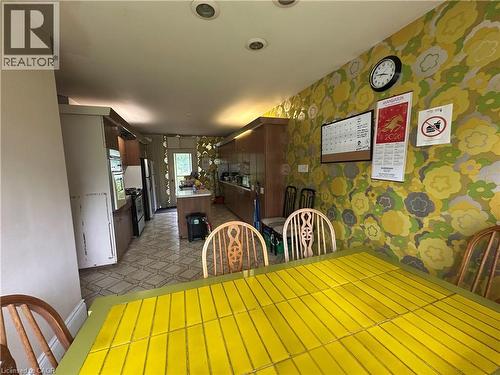 Dining area featuring patterned wallpaper and recessed lighting - 11 Wilmont Court, Hamilton, ON 