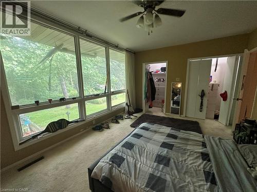 Room featuring expansive windows with exterior tree views - 11 Wilmont Court, Hamilton, ON 