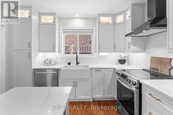 Farmhouse Sink and Glass Upper Display Cabinets - 