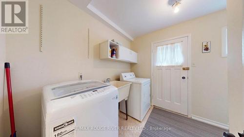 Laundry With Side Door - 33 Pepper Tree Drive, Toronto, ON - Indoor Photo Showing Laundry Room