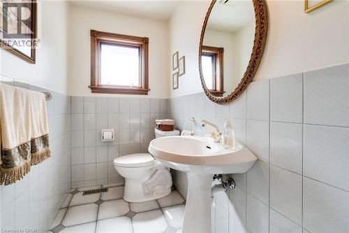 2-piece powder room on main floor, ceramic flooring. - 2560 Rugby Road, Mississauga, ON 