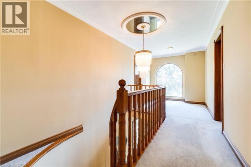 Upper-level hallway, broadloom, wood railings. - 2560 Rugby Road, Mississauga, ON 