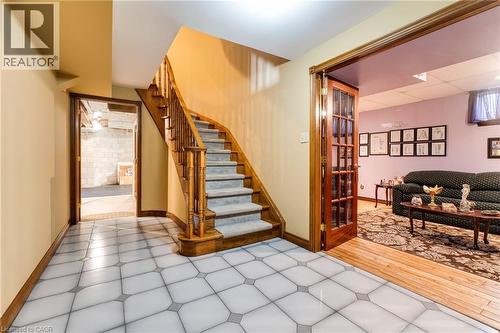 Lower level staircase, ceramic flooring. - 2560 Rugby Road, Mississauga, ON 