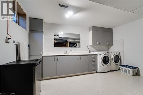 Basement laundry, vinyl flooring. - 2560 Rugby Road, Mississauga, ON 