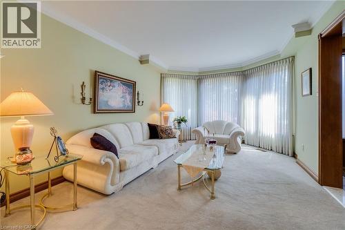 Combined living/dining room, large bay windows, broadloom, crown mouldings. - 2560 Rugby Road, Mississauga, ON 
