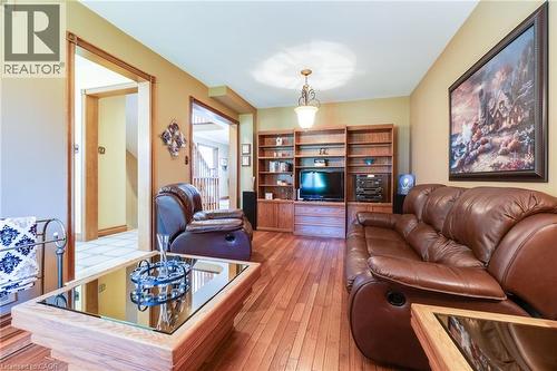 Family room with hardwood flooring, opened to breakfast area. - 2560 Rugby Road, Mississauga, ON 