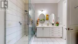 Large ensuite vanity with multiple storage drawers - 