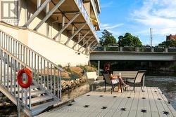 Floating deck with benches, table and chairs - 
