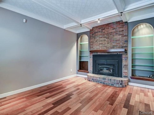 Salon - 1690 Rue Tillemont, Brossard, QC - Indoor Photo Showing Living Room With Fireplace
