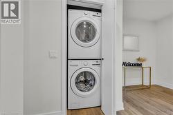 Integrated stacked washer and dryer in a dedicated closet - 