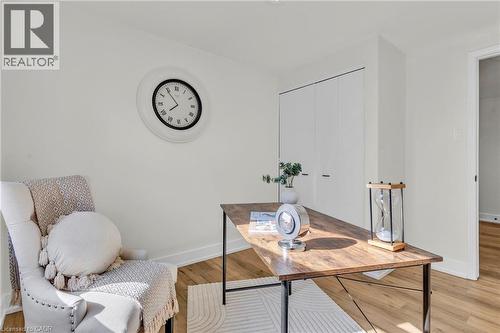Neutral wall finishes complement the wood-finish flooring - 127 Acorn Crescent, London, ON 