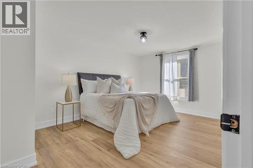 Light wood-finish flooring complements the neutral wall tones - 127 Acorn Crescent, London, ON 