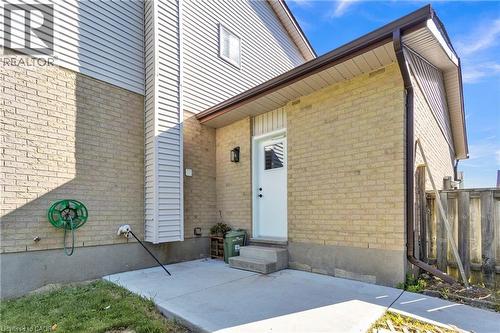 Exterior showcasing light-toned brick and horizontal siding - 127 Acorn Crescent, London, ON 