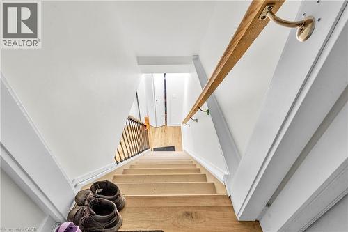 Hardwood staircase with natural wood treads and white risers - 127 Acorn Crescent, London, ON 