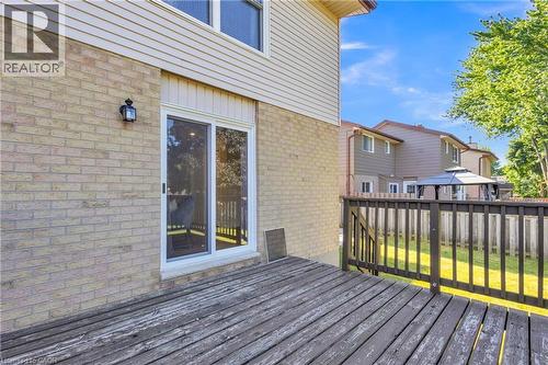 Rear outdoor deck featuring wood planking and a wooden railing - 127 Acorn Crescent, London, ON 
